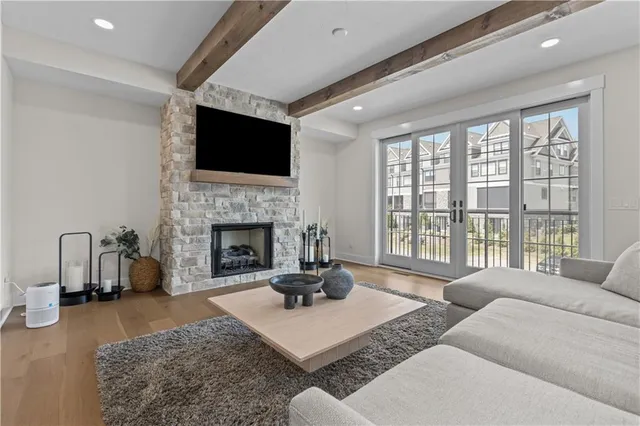 a living room with furniture fireplace and a flat screen tv