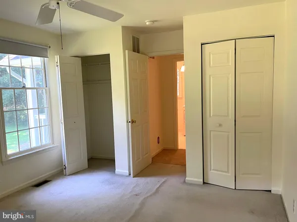a view of a bathroom with a shower and a tub