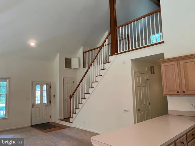 a view of a hallway with staircase