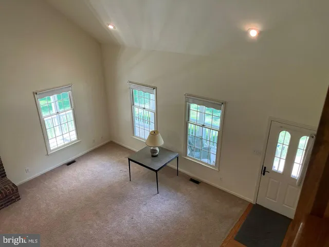 a view of a house with a yard and garage