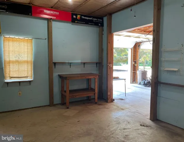 a bathroom with a shower and a sink