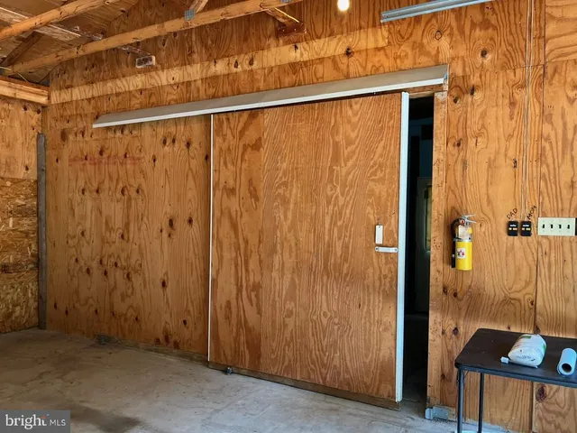 a view of a park with trees in the background