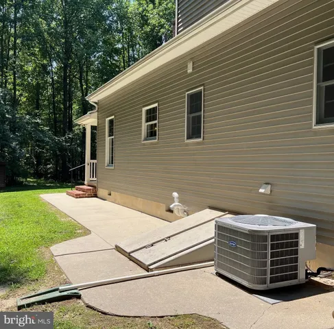 a backyard of a house with yard and trees