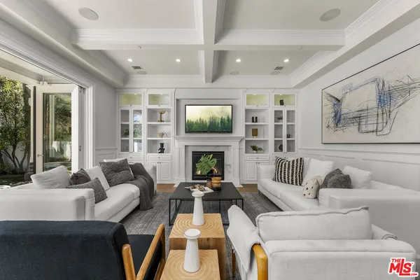 a kitchen with stainless steel appliances granite countertop a white cabinets and wooden floor