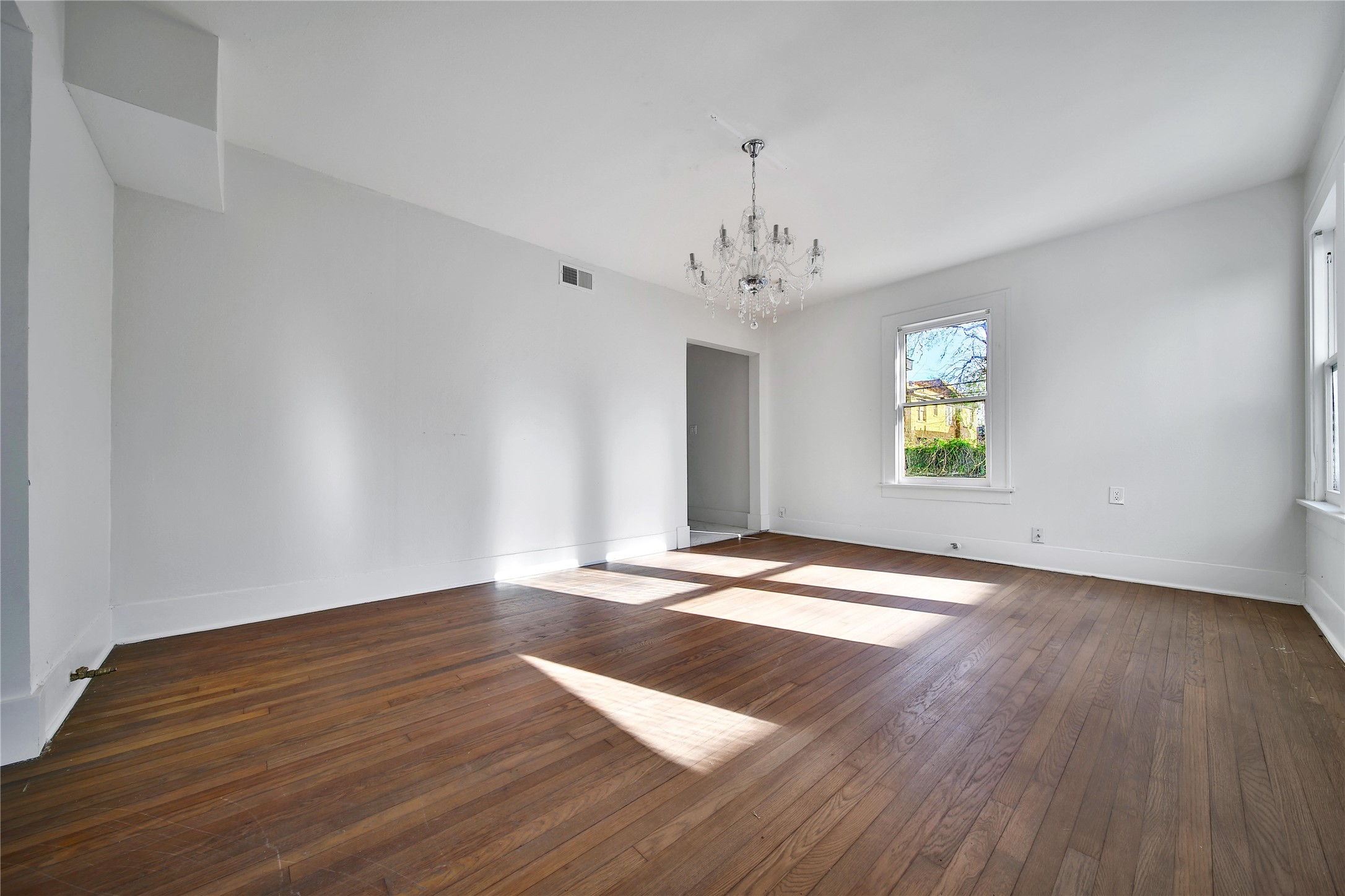 2405 Arbor Street Houston, TX 77004 - Photo 11 of 41 a view of empty room with wooden floor and window