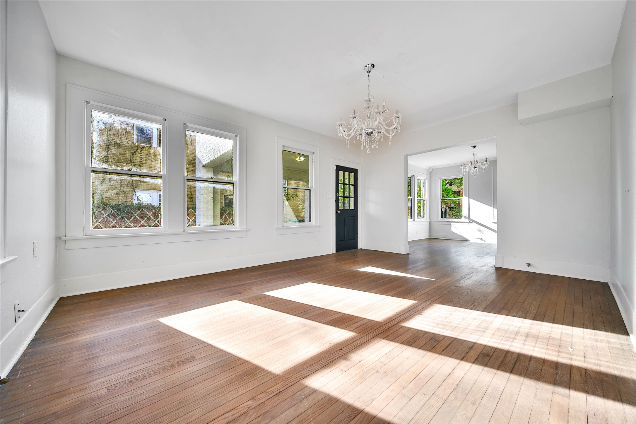 2405 Arbor Street Houston, TX 77004 - Photo 13 of 41 a view of an empty room with wooden floor and a window