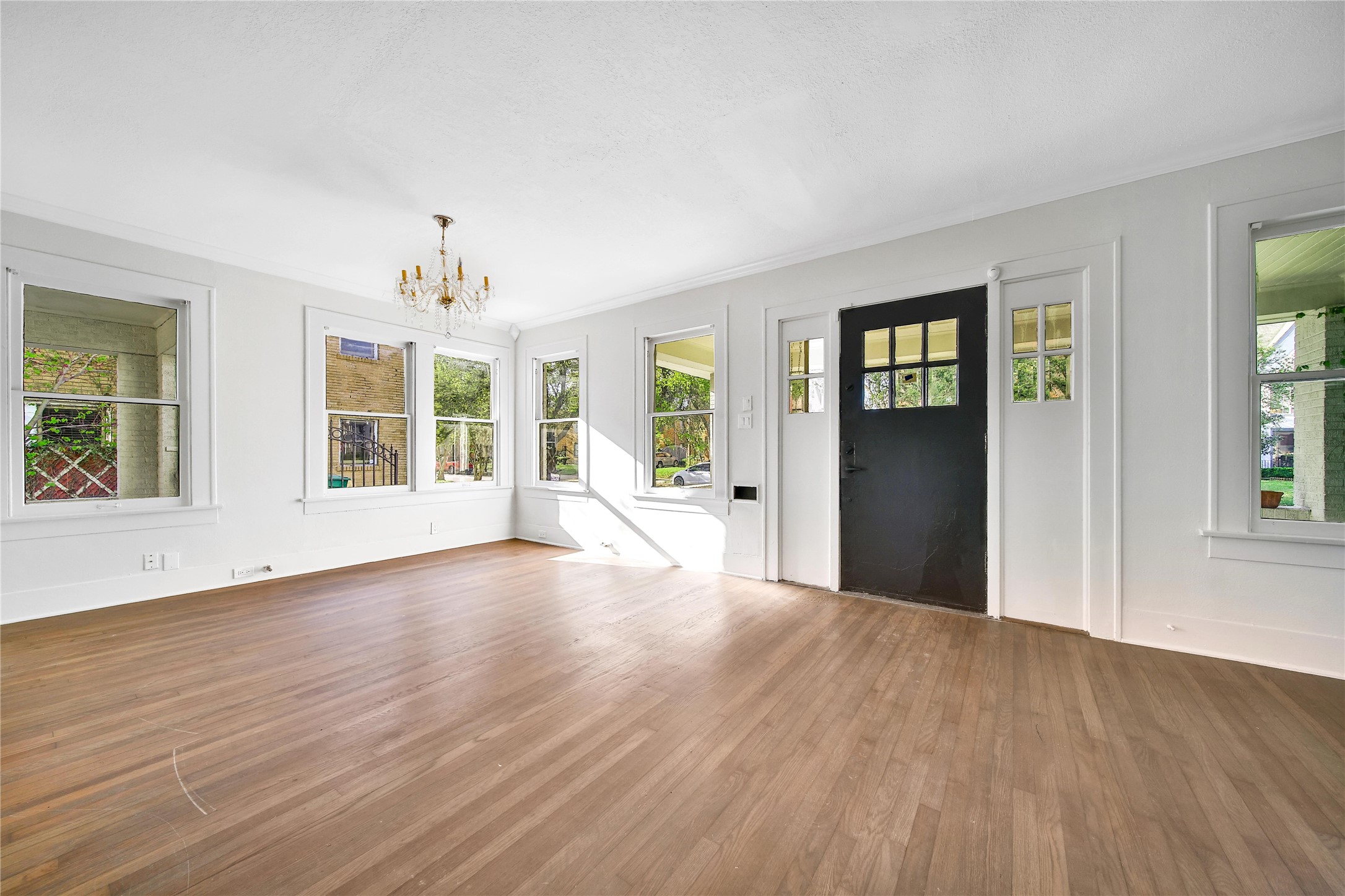 2405 Arbor Street Houston, TX 77004 - Photo 14 of 41 a view of an empty room with wooden floor and a window