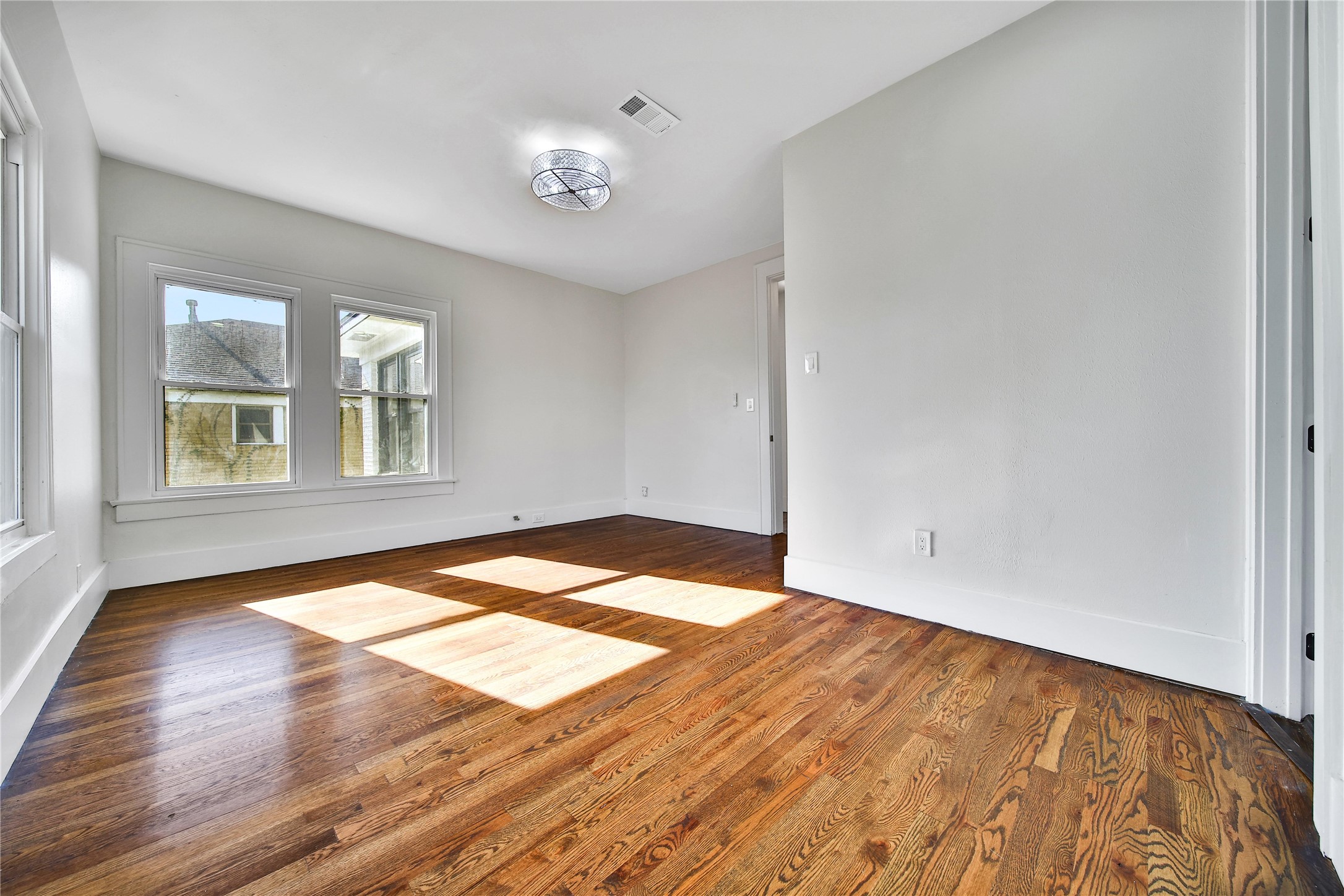 2405 Arbor Street Houston, TX 77004 - Photo 23 of 41 a view of empty room with wooden floor and fan