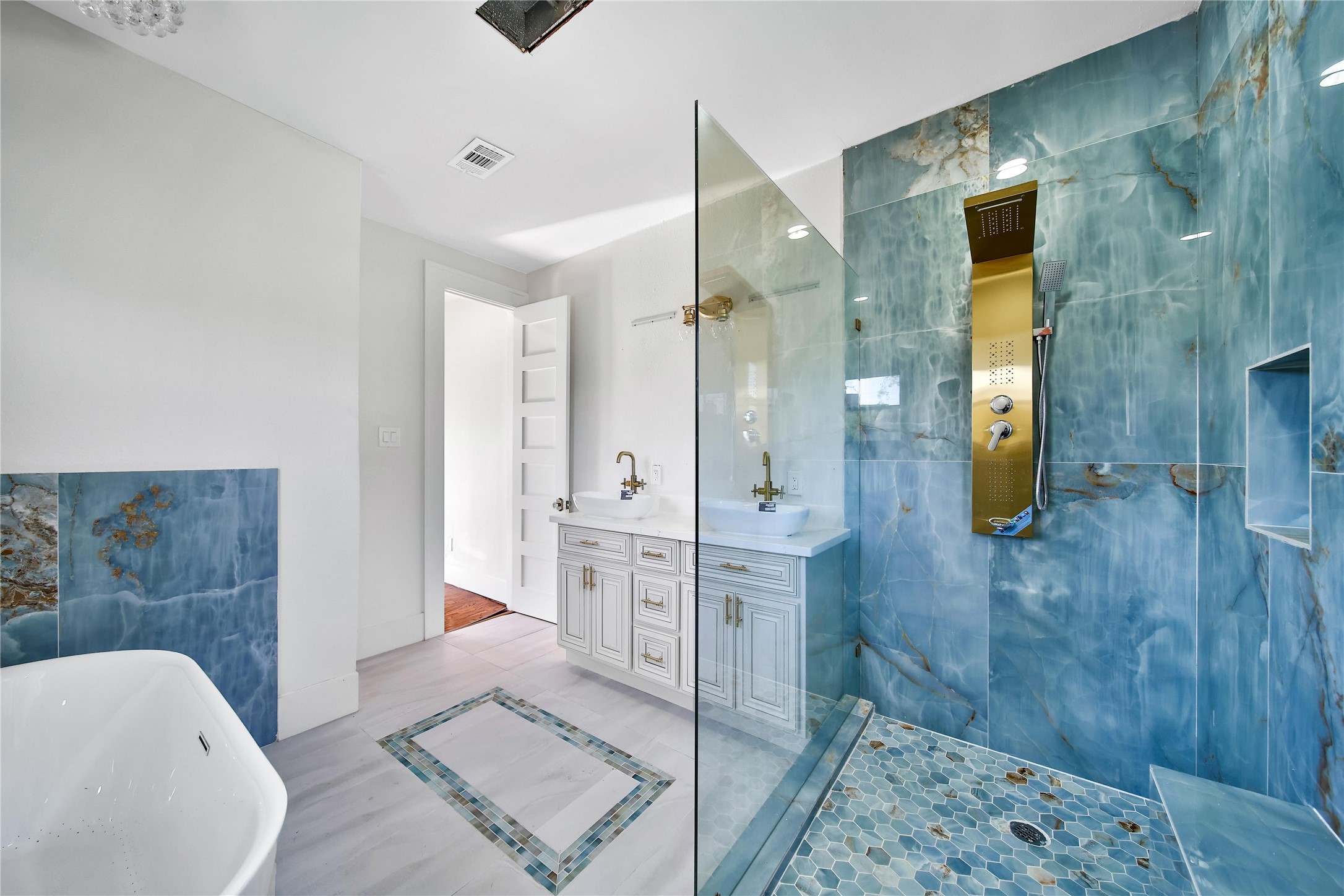 2405 Arbor Street Houston, TX 77004 - Photo 25 of 41 a bathroom with a tub and shower