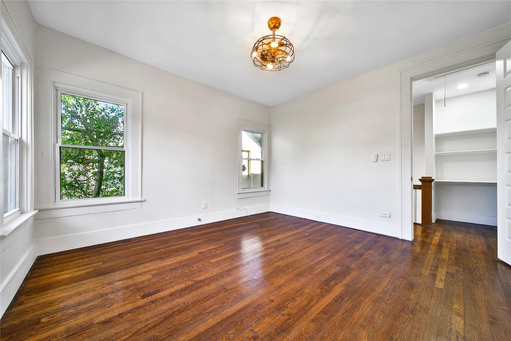 2405 Arbor Street Houston, TX 77004 - Photo 29 of 41 an empty room with wooden floor and window