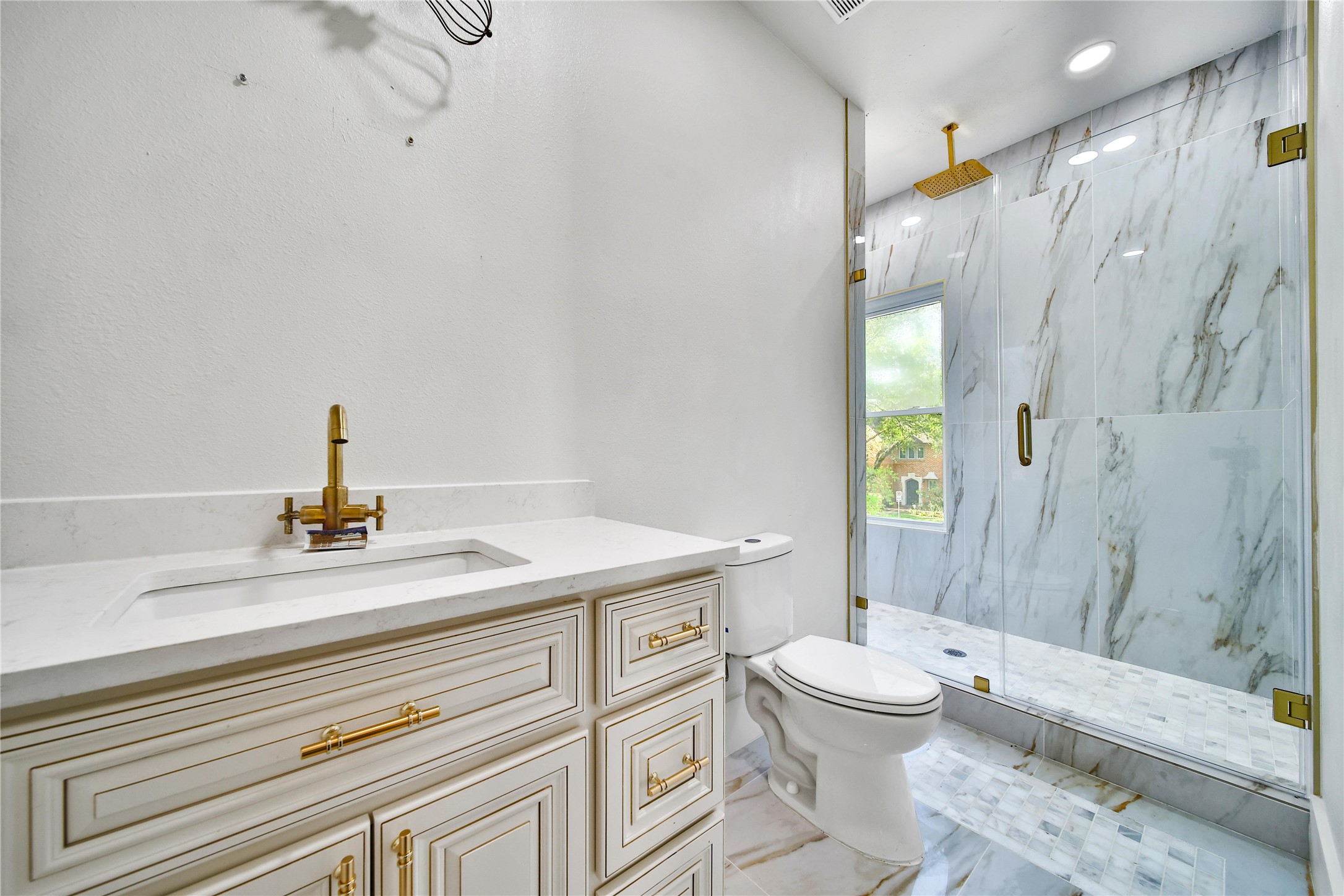 2405 Arbor Street Houston, TX 77004 - Photo 30 of 41 a bathroom with a sink a toilet and shower