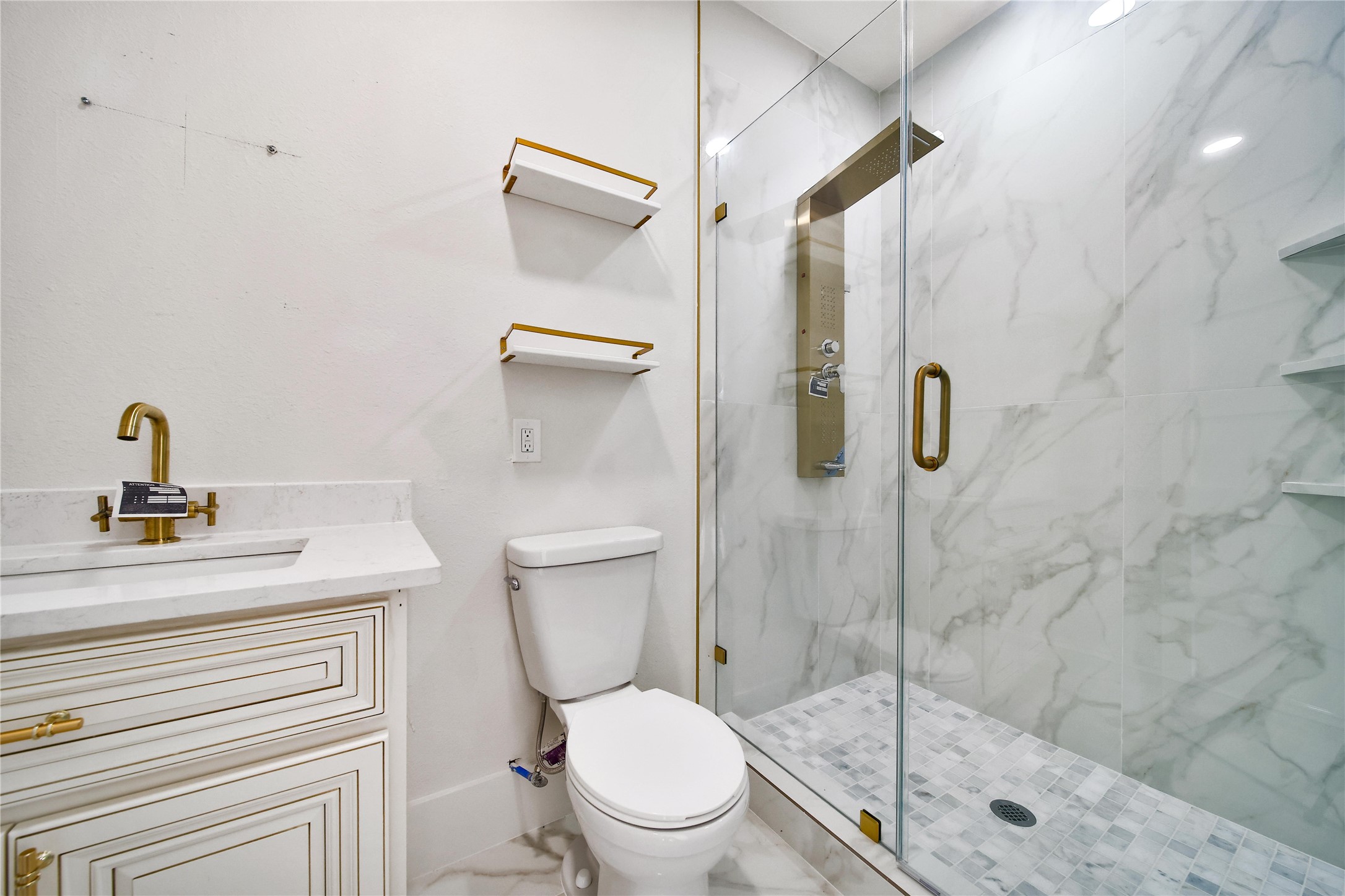 2405 Arbor Street Houston, TX 77004 - Photo 34 of 41 a bathroom with a shower a toilet and a sink