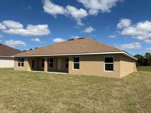 a front view of the house with yard