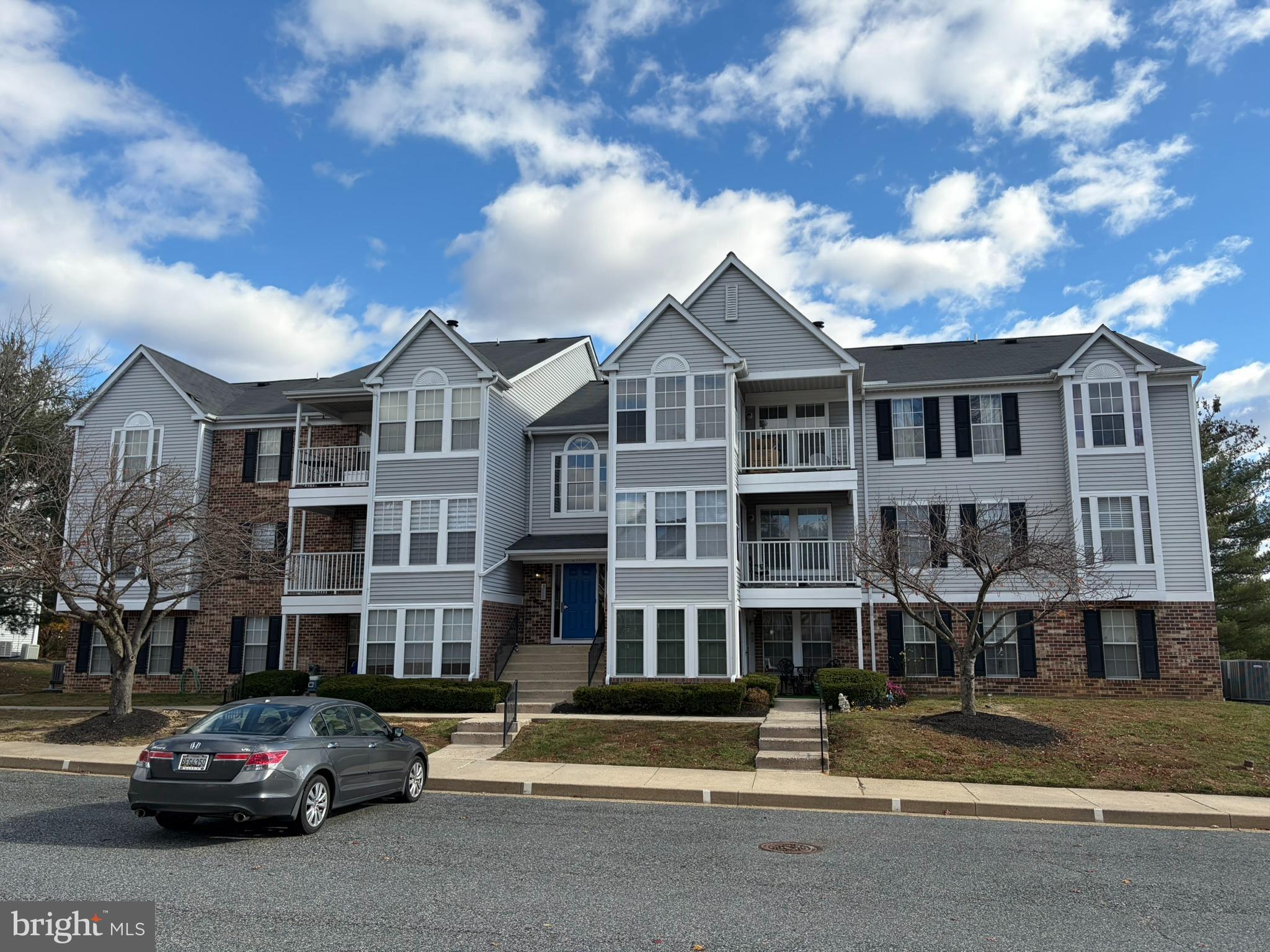 1401 F Sage Lane Belcamp, MD 21017 - Photo 1 of 30 a city street lined with buildings and cars