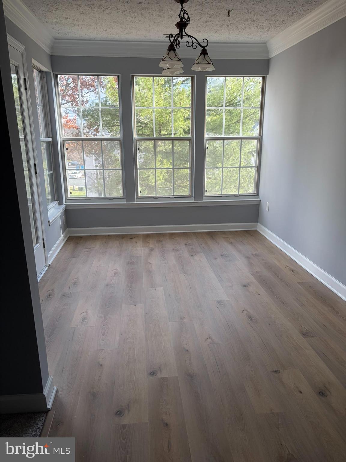 1401 F Sage Lane Belcamp, MD 21017 - Photo 14 of 30 an empty room with wooden floor and windows