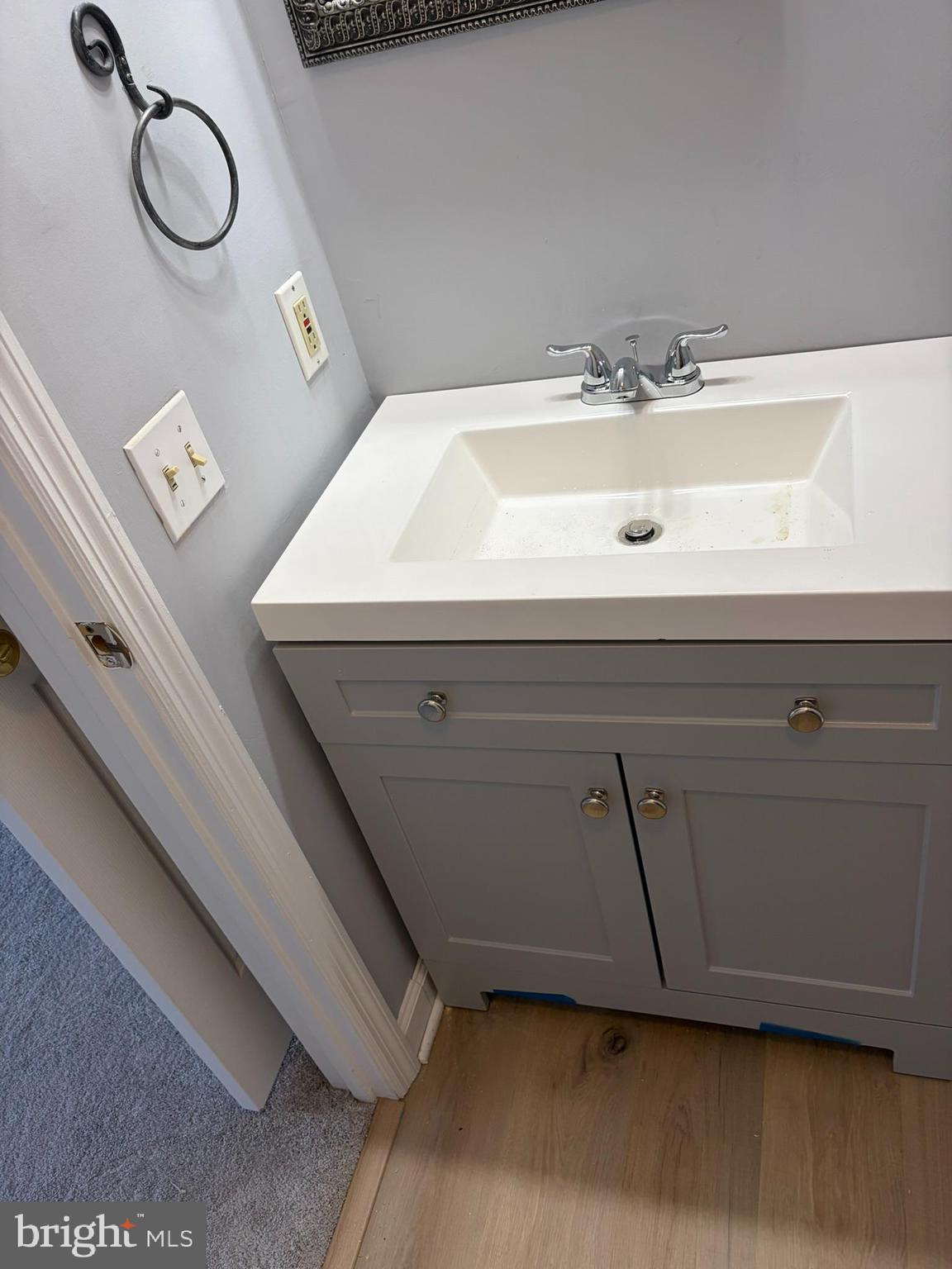 1401 F Sage Lane Belcamp, MD 21017 - Photo 27 of 30 a bathroom with a sink and a mirror