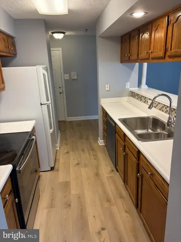 a view of a kitchen with a sink