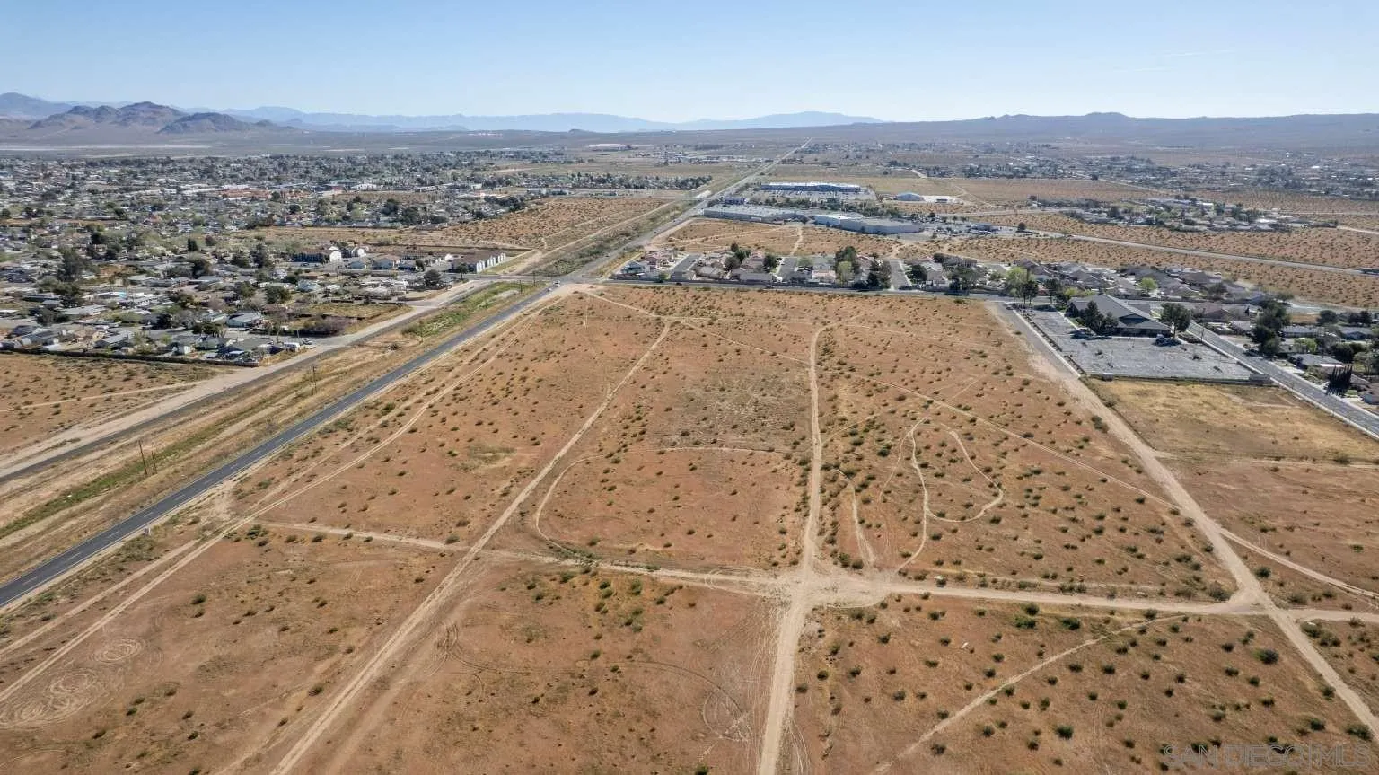 0 Between Vulcon Avenue, Unit 3 AND 4 Ridgecrest, CA 93555 - Photo 6 of 42 an aerial view of residential houses with outdoor space