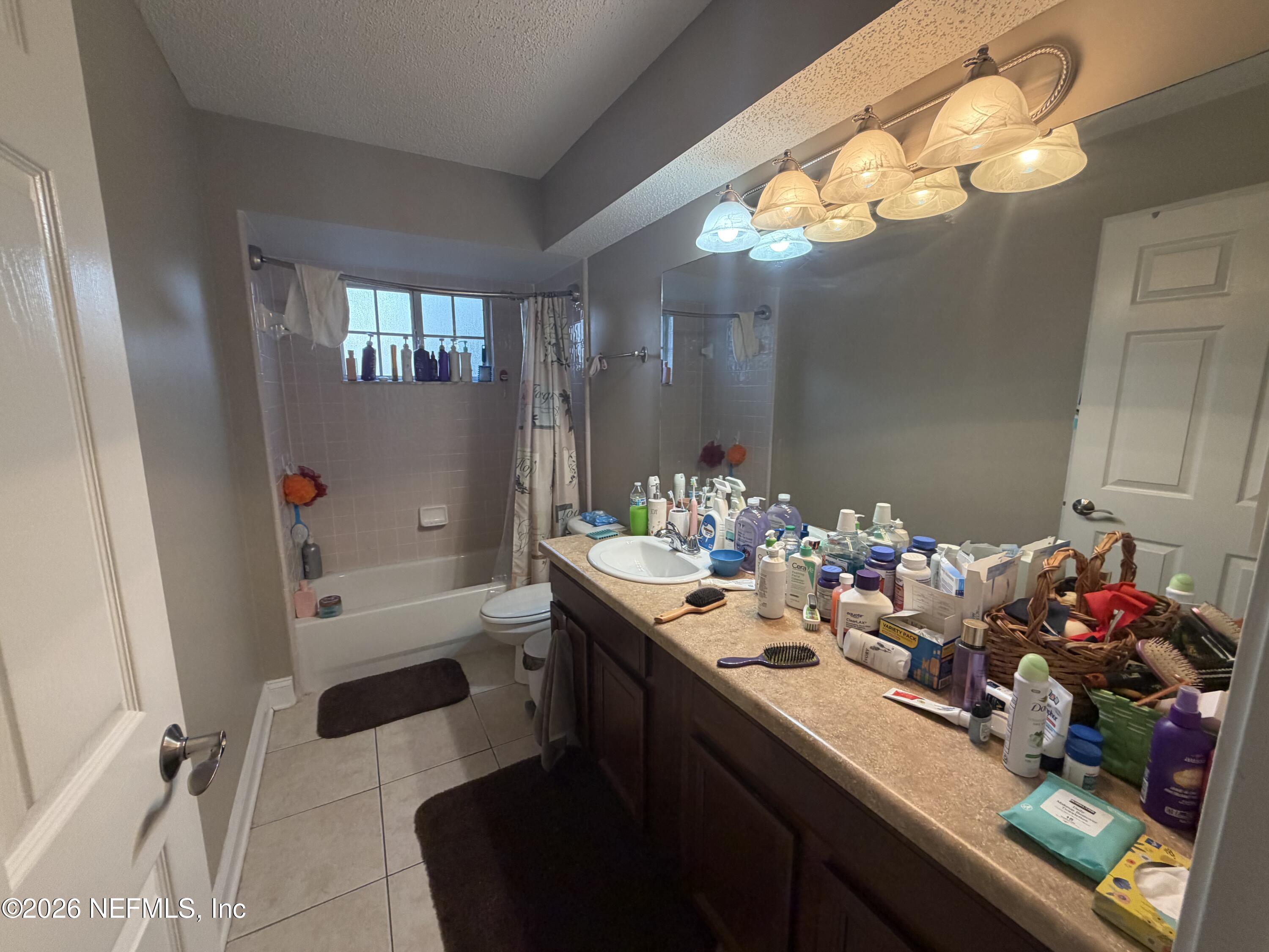 1478 Winston Lane Fleming Island, FL 32003 - Photo 10 of 15 a bathroom with a sink mirror and vanity