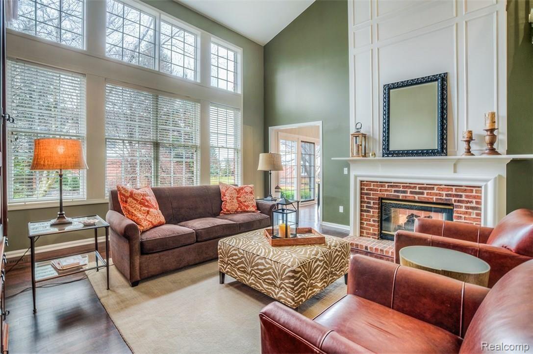 756 Loggers Circle Rochester, MI 48307 - Photo 13 of 39 With a two-way fireplace, two-story vaulted ceilings and wall of windows, this Family Room is where most of your time will probably be spent!