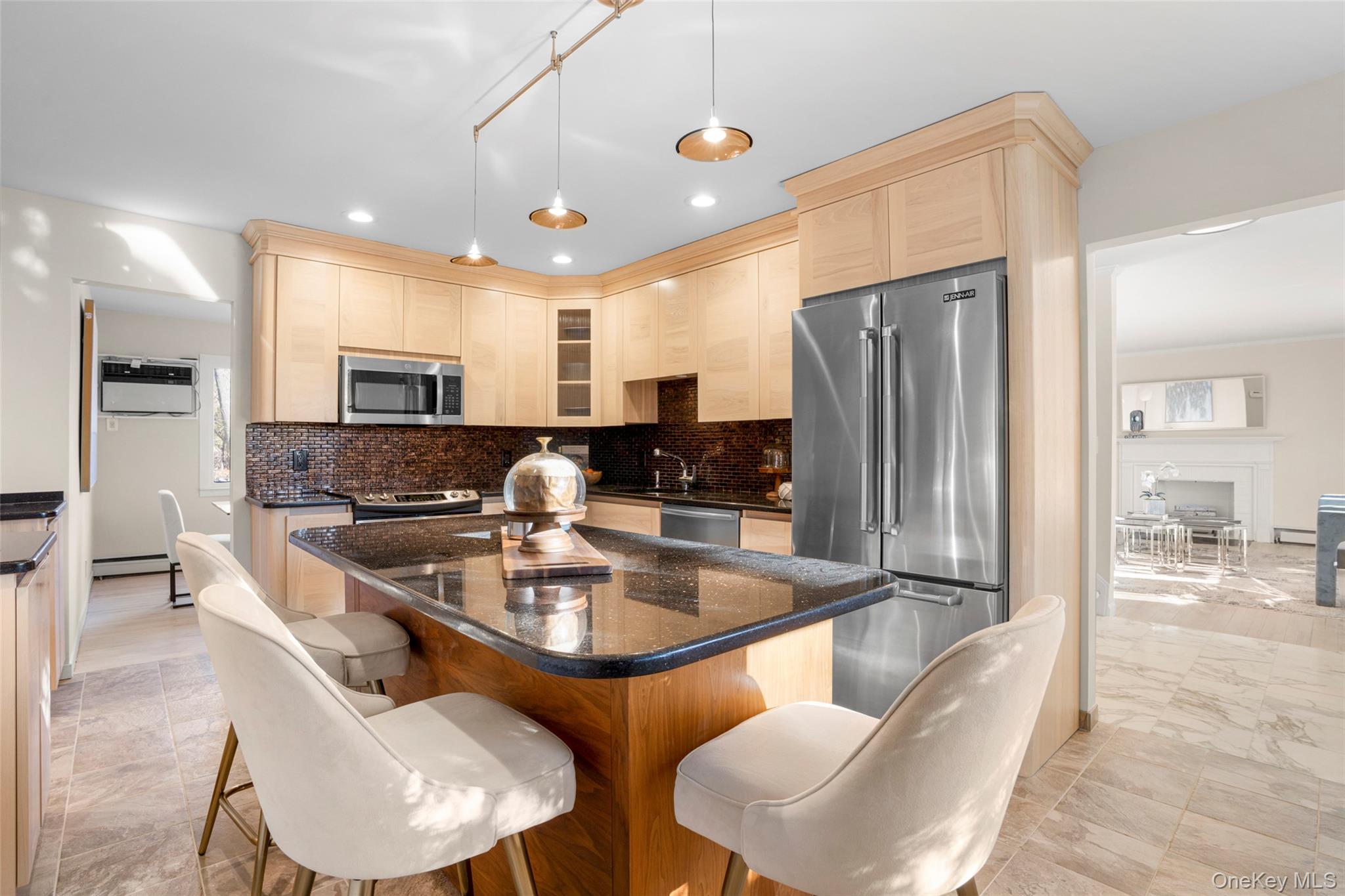 151 Hilburn Road Scarsdale, NY 10583 - Photo 11 of 40 a kitchen with stainless steel appliances granite countertop a sink a stove a refrigerator cabinets and chairs