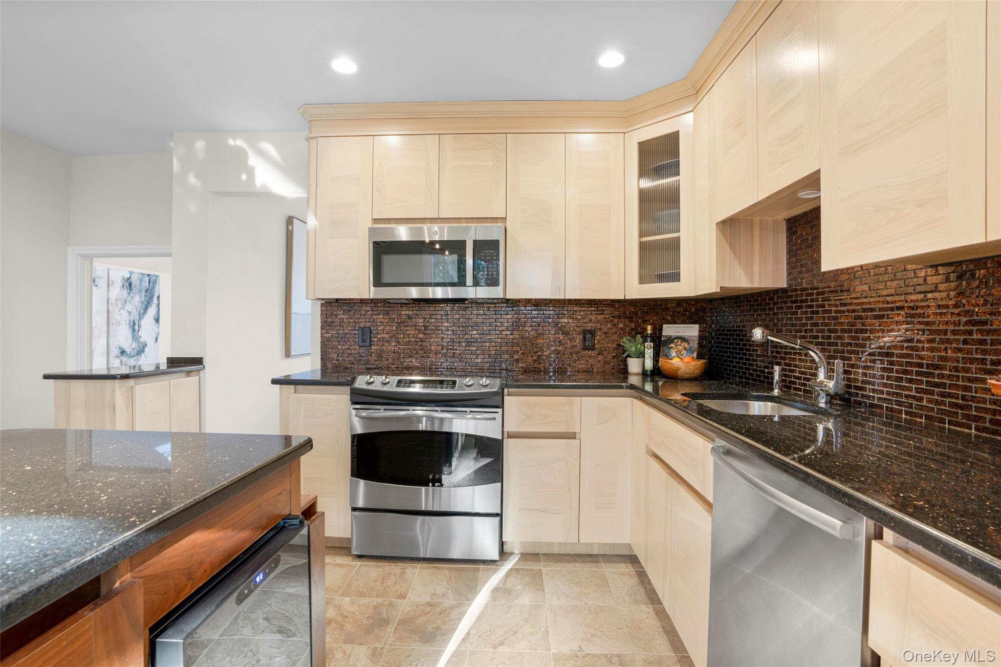 151 Hilburn Road Scarsdale, NY 10583 - Photo 12 of 40 a kitchen with stainless steel appliances granite countertop a sink and a stove