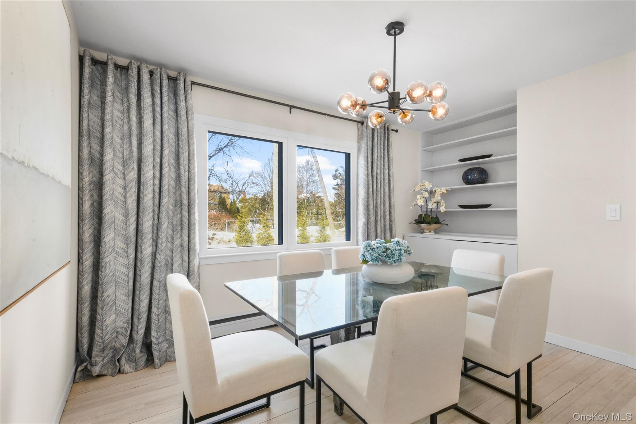 151 Hilburn Road Scarsdale, NY 10583 - Photo 13 of 40 a view of a dining room with furniture window and wooden floor