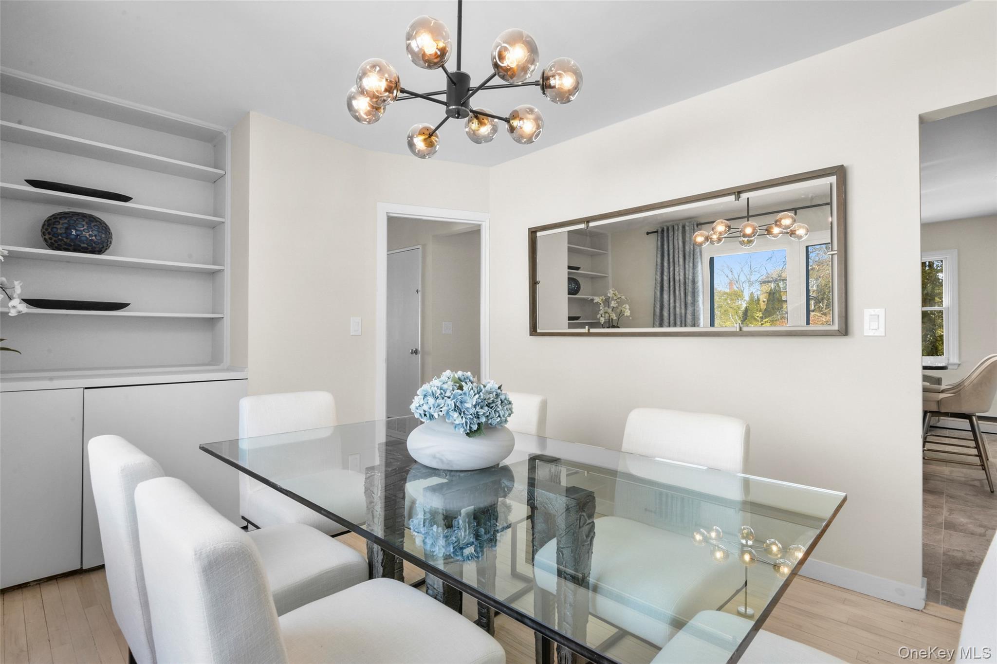 151 Hilburn Road Scarsdale, NY 10583 - Photo 14 of 40 a dining room with furniture and wooden floor