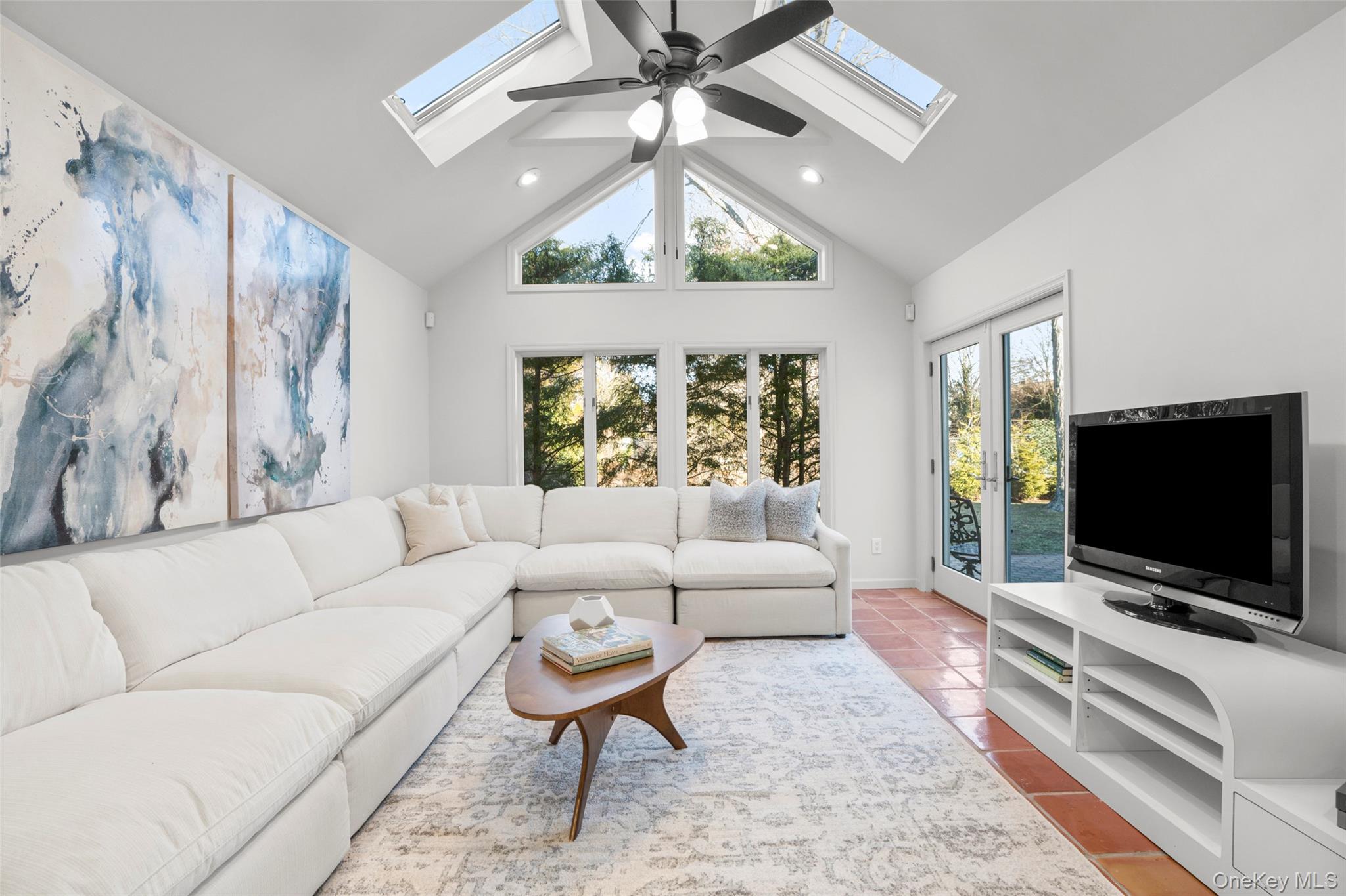 151 Hilburn Road Scarsdale, NY 10583 - Photo 16 of 40 a living room with furniture and a flat screen tv