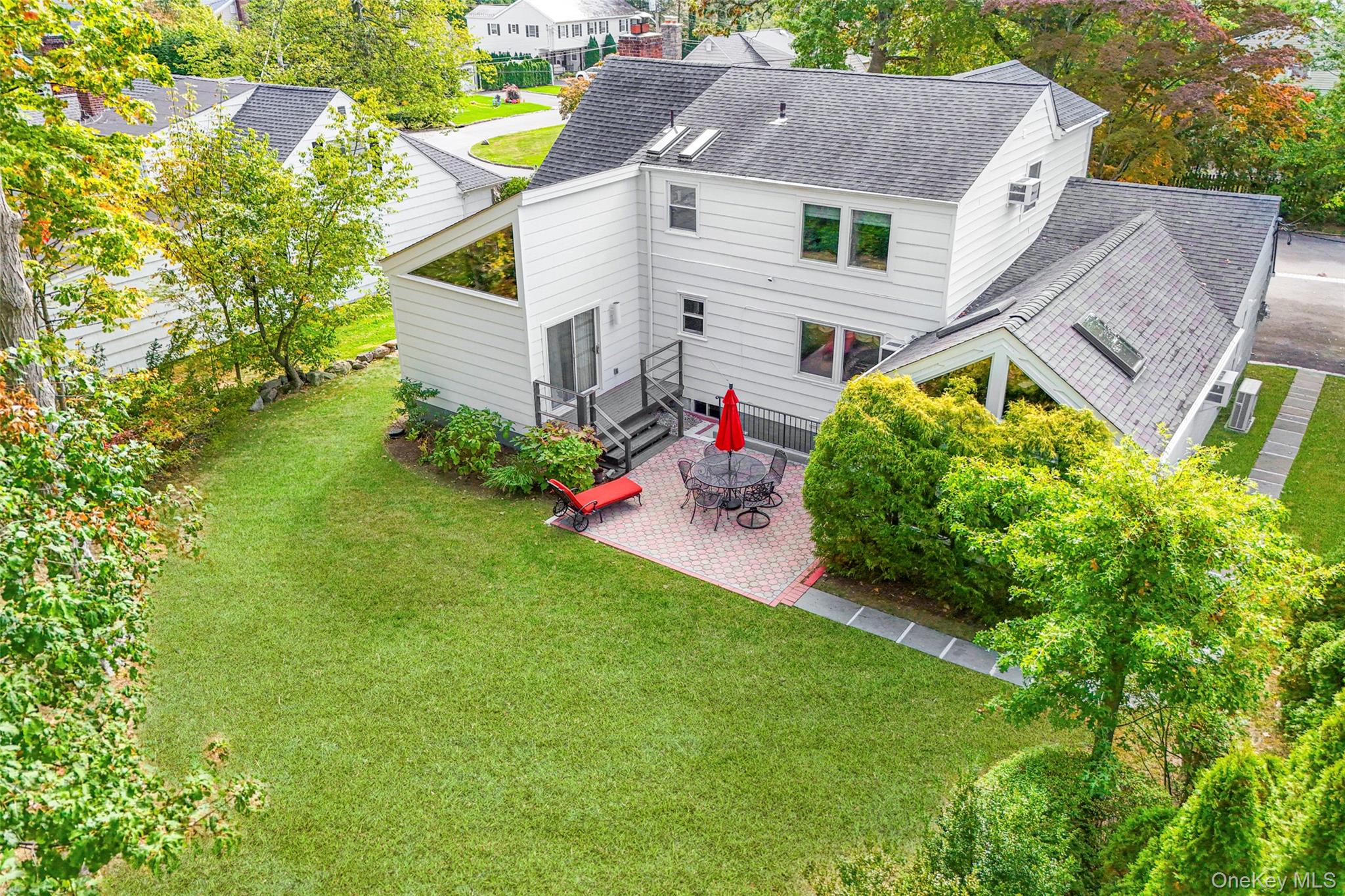 151 Hilburn Road Scarsdale, NY 10583 - Photo 35 of 40 a house view with a garden space