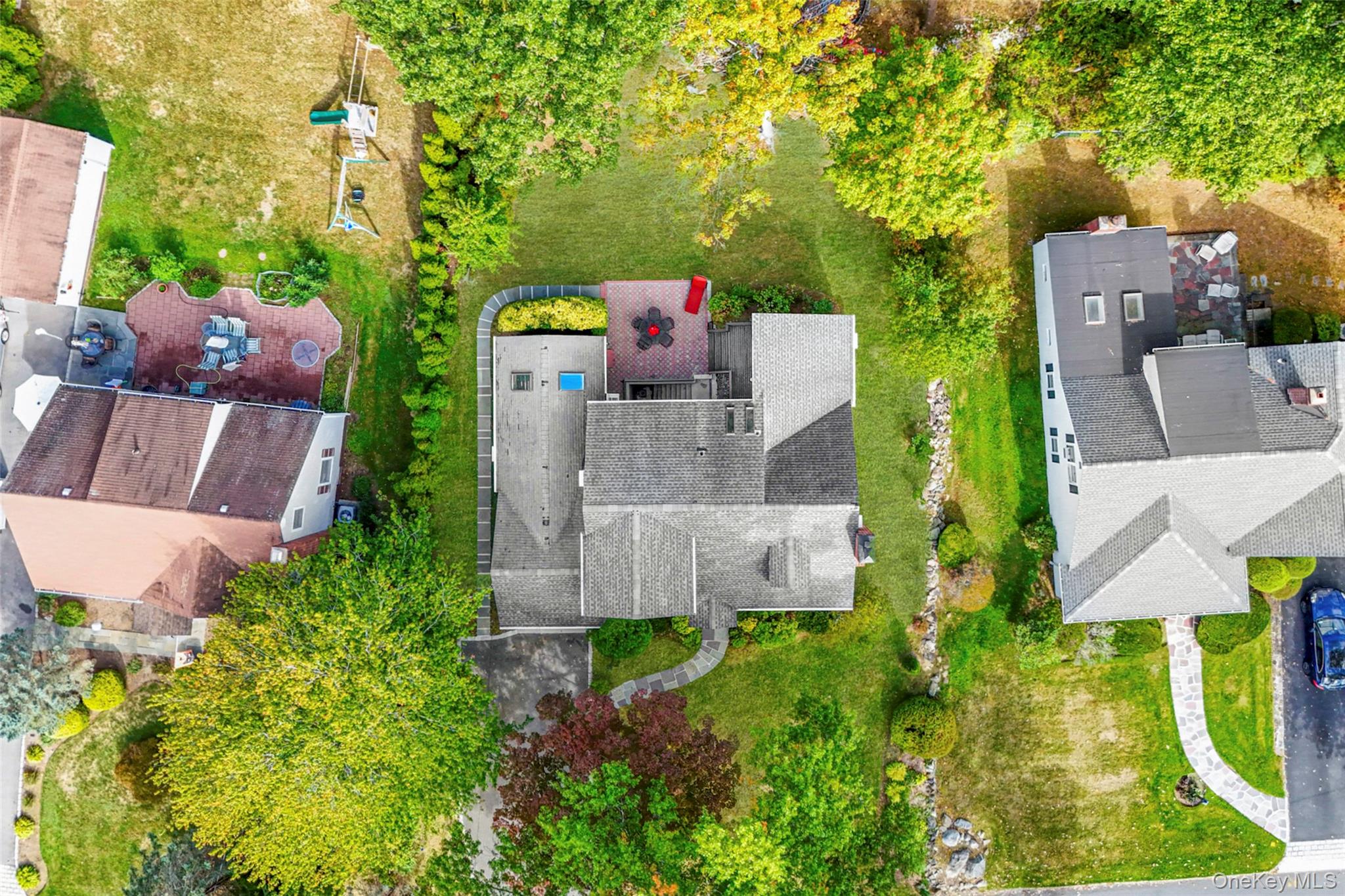 151 Hilburn Road Scarsdale, NY 10583 - Photo 36 of 40 an aerial view of a house with a yard basket ball court and outdoor seating