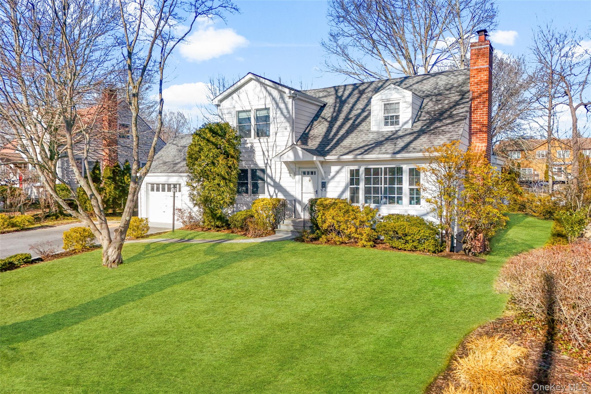 151 Hilburn Road Scarsdale, NY 10583 - Photo 37 of 40 a view of a house with a yard