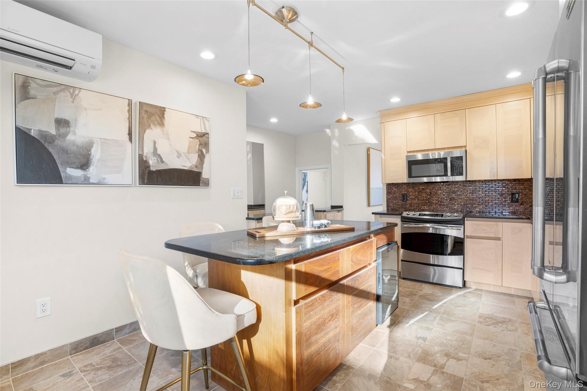 151 Hilburn Road Scarsdale, NY 10583 - Photo 9 of 40 a kitchen with a sink cabinets and microwave