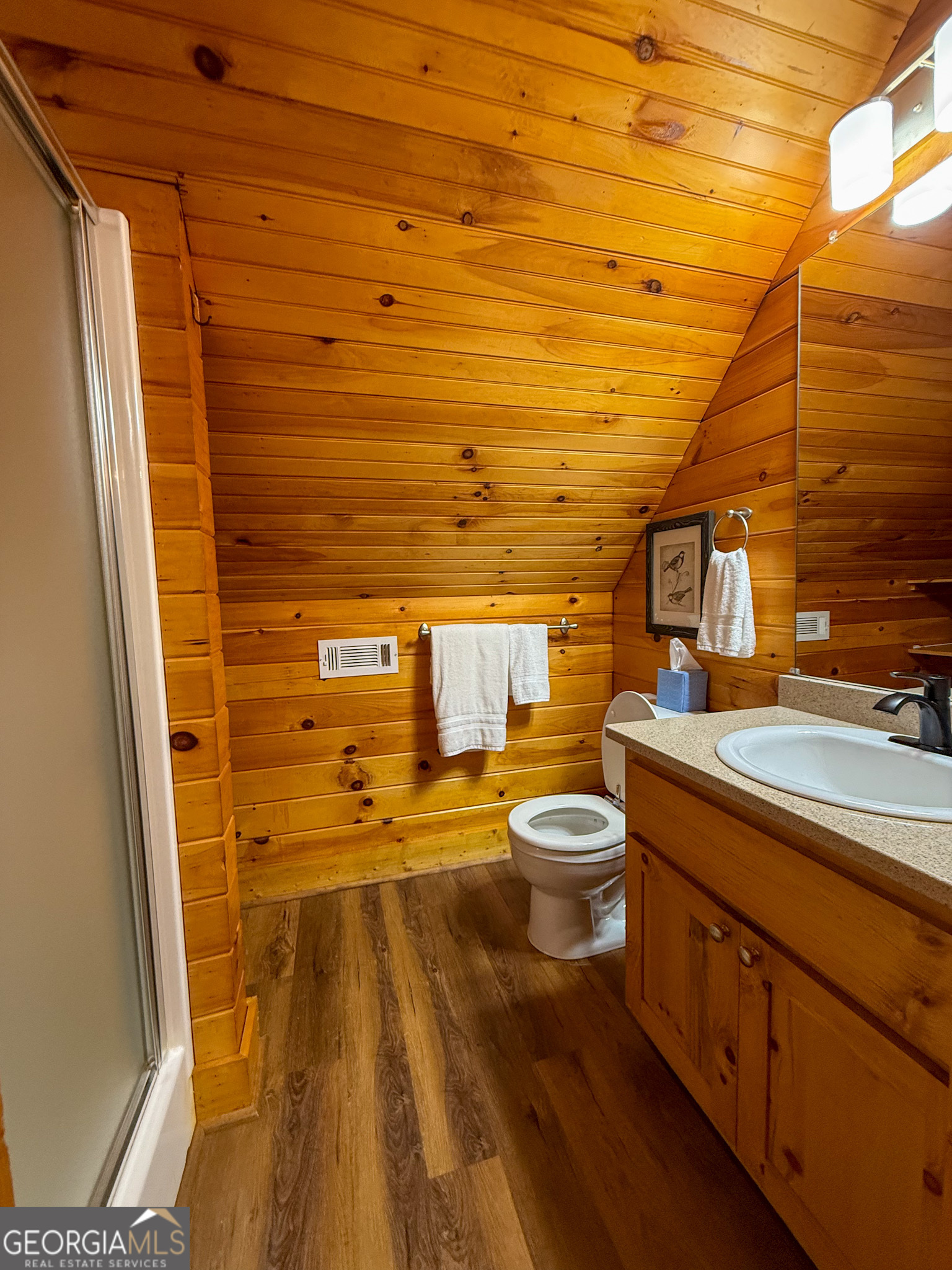2980 Sky Lake Road Sautee Nacoochee, GA 30571 - Photo 16 of 22 a bathroom with a sink a toilet and shower