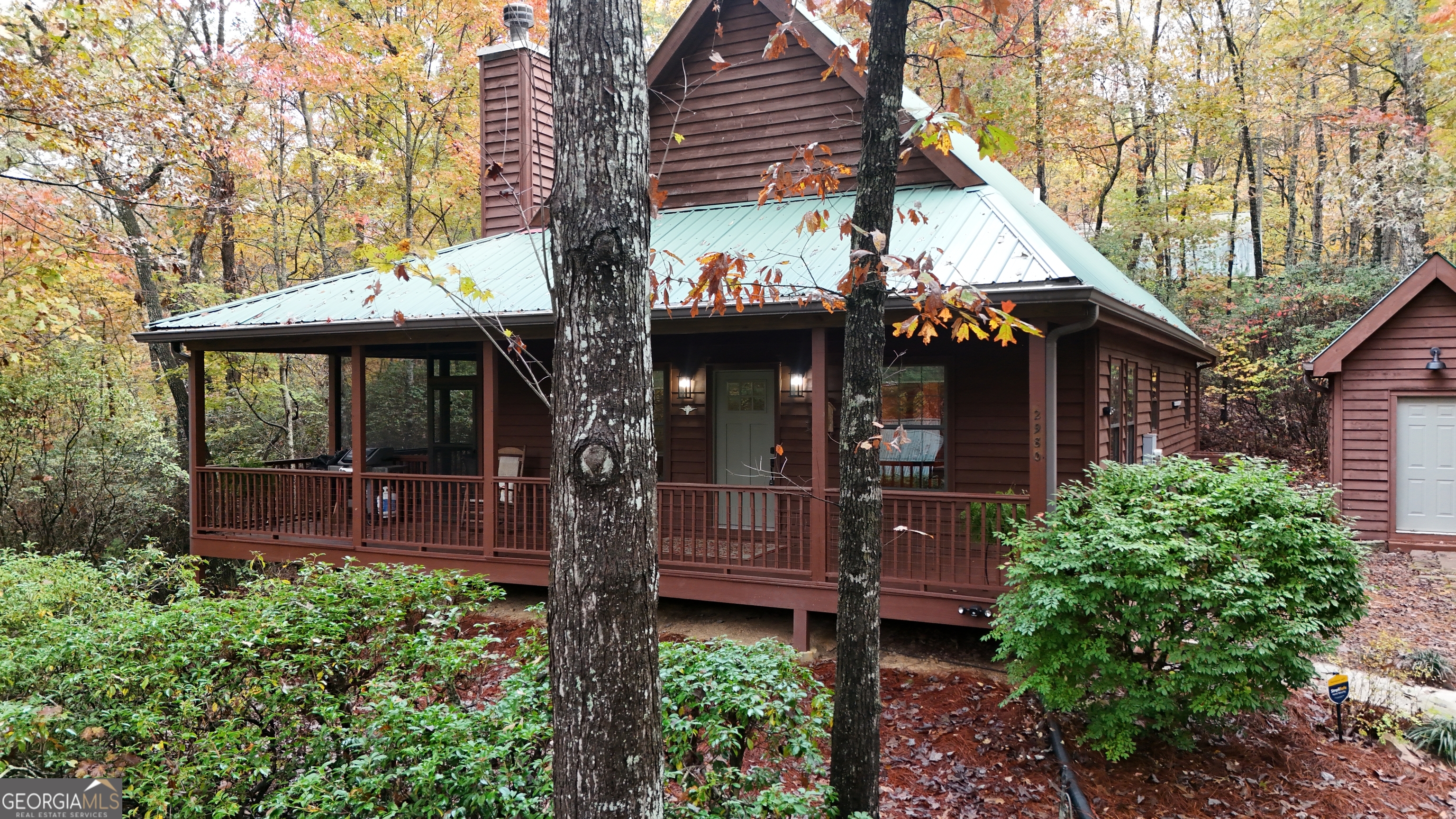 2980 Sky Lake Road Sautee Nacoochee, GA 30571 - Photo 21 of 22 a view of a house with tub and trees around