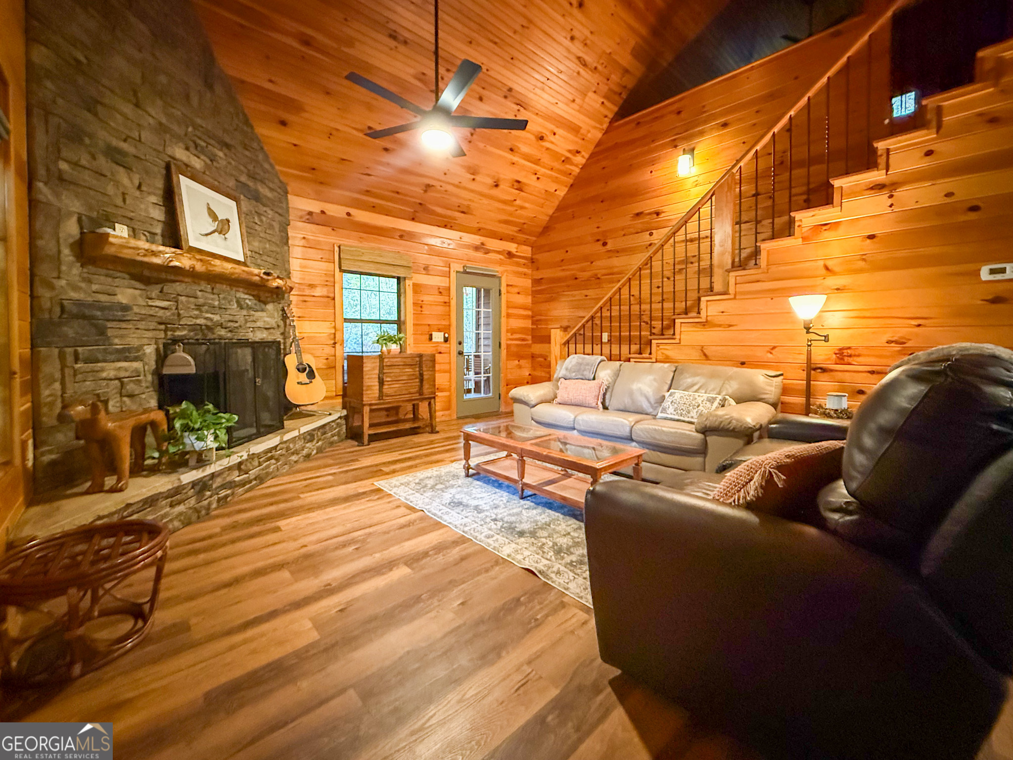 2980 Sky Lake Road Sautee Nacoochee, GA 30571 - Photo 4 of 22 a living room with furniture and a fireplace