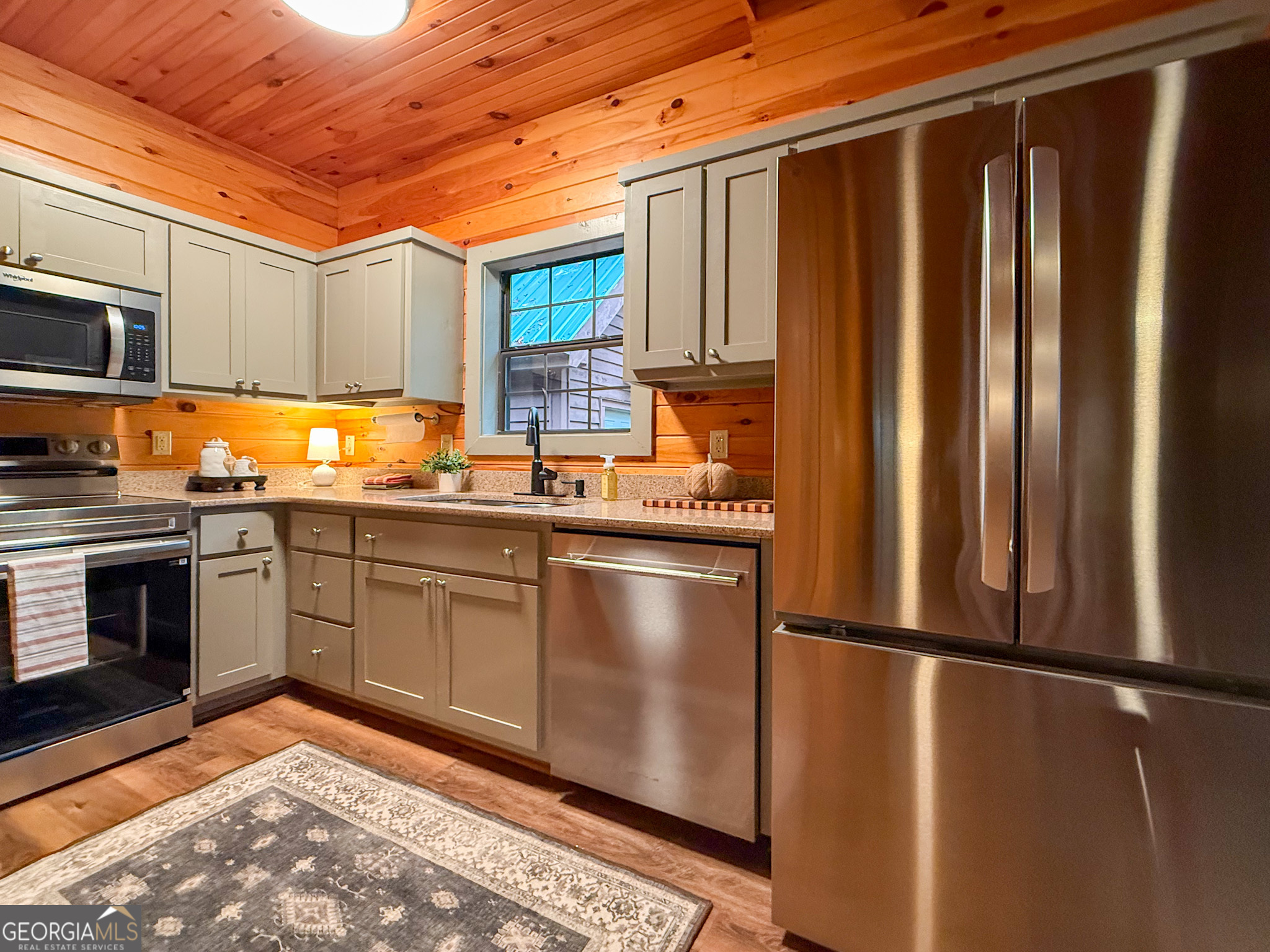 2980 Sky Lake Road Sautee Nacoochee, GA 30571 - Photo 7 of 22 a kitchen with stainless steel appliances granite countertop a refrigerator a sink dishwasher a stove top oven a sink and dishwasher