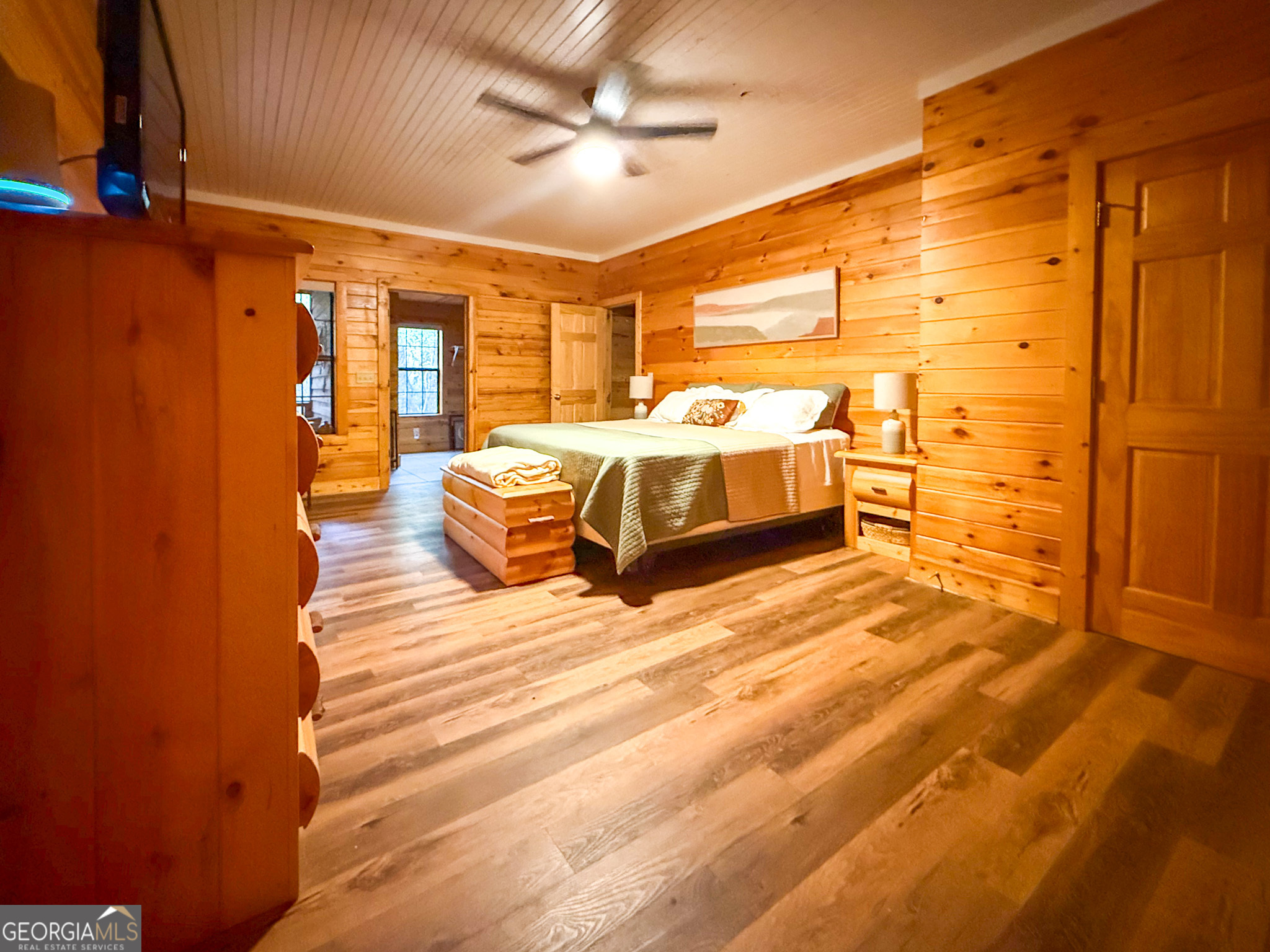 2980 Sky Lake Road Sautee Nacoochee, GA 30571 - Photo 8 of 22 a spacious bedroom with a bed and wooden floor