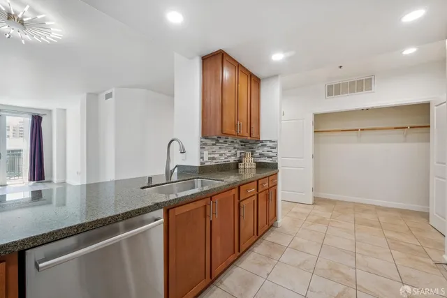 a kitchen with a sink and cabinets