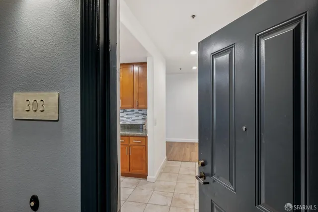 a view of a hallway with wooden floor