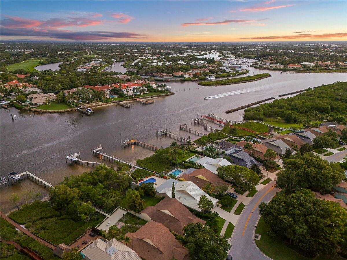 352 River Edge Road Jupiter, FL 33477 - Photo 48 of 56 an aerial view of residential houses with outdoor space