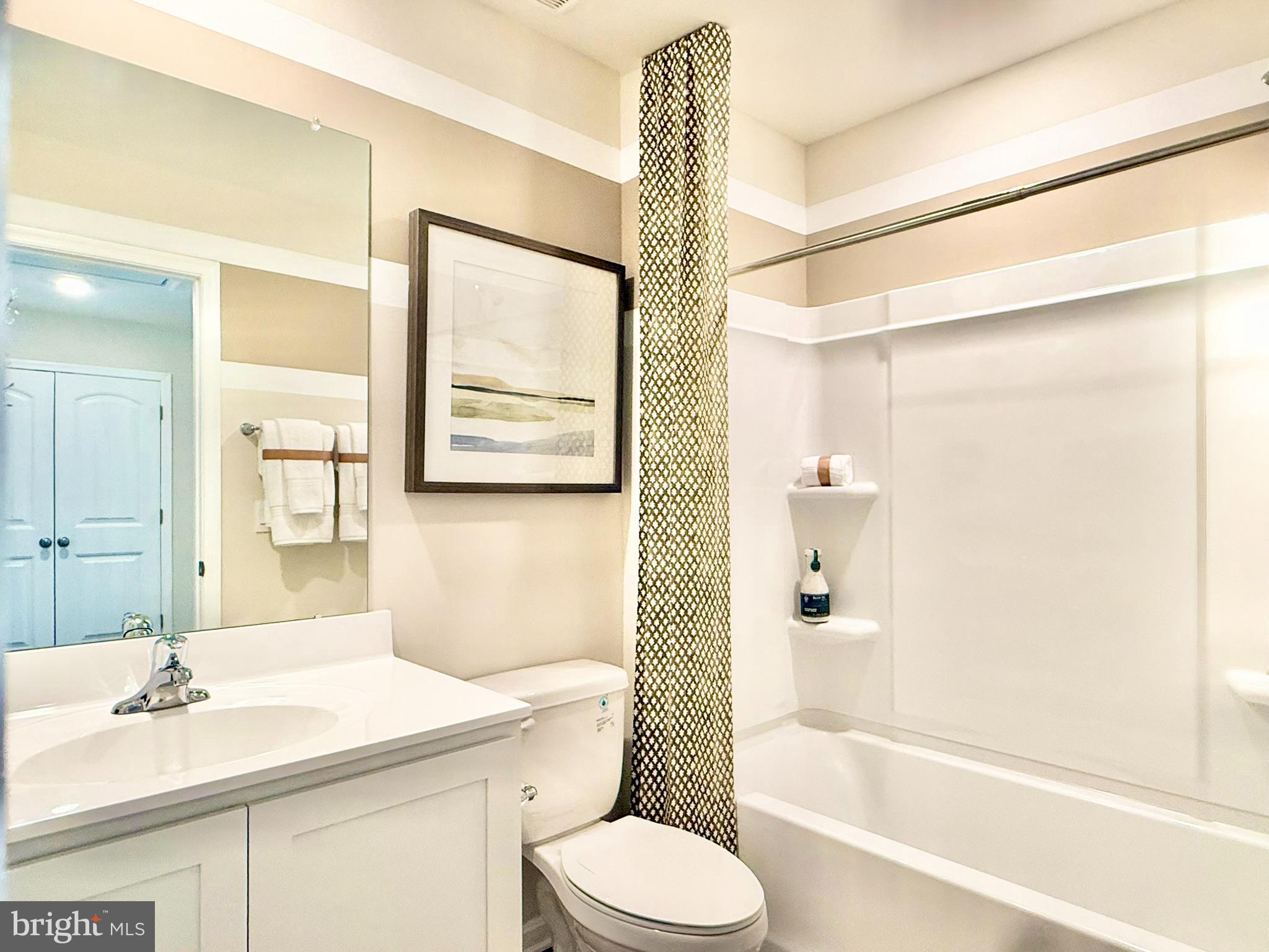 21456 Farmington Road Frankford, DE 19945 - Photo 25 of 30 a bathroom with a sink toilet and shower