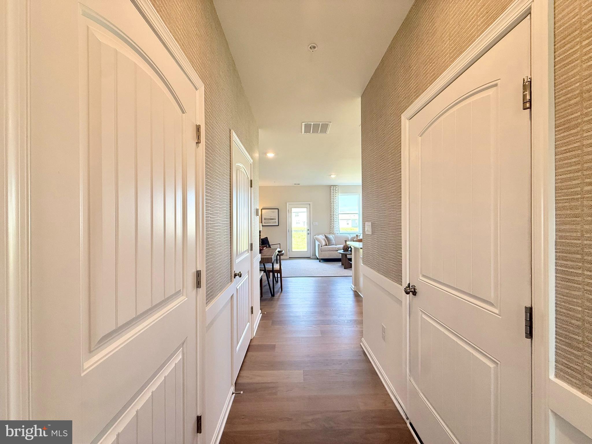 21456 Farmington Road Frankford, DE 19945 - Photo 4 of 30 a view of a hallway with wooden floor and furniture