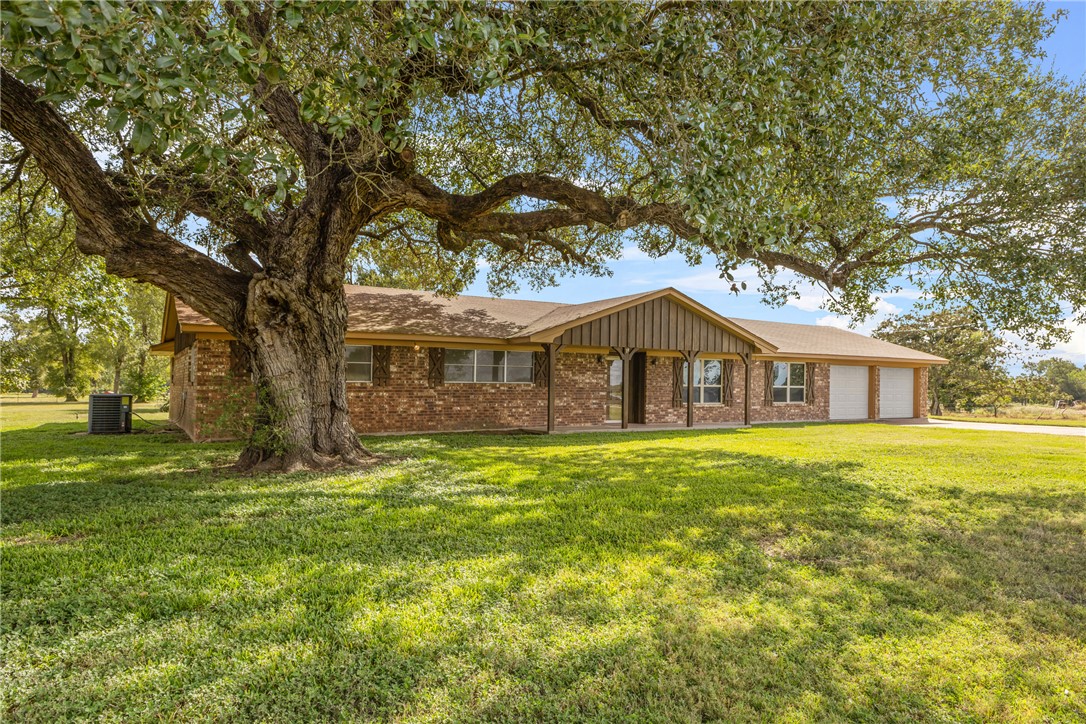 12331 Fm 2155 Somerville, TX 77879 - Photo 1 of 35 a front view of a house with a yard