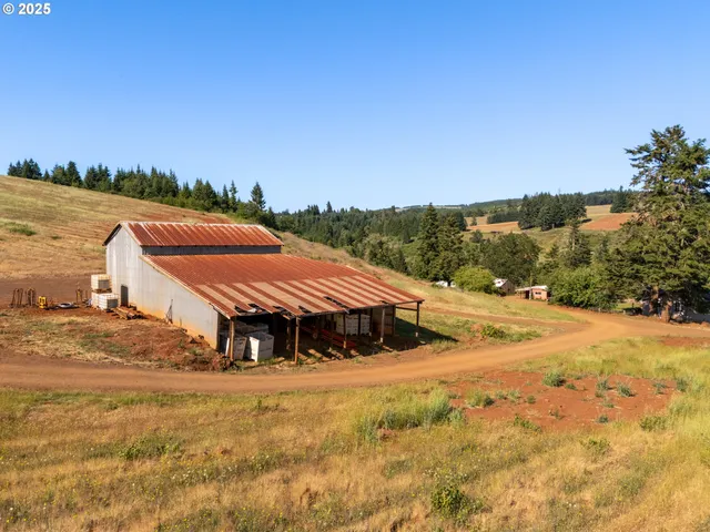 a view of a big house with a mountain in the background