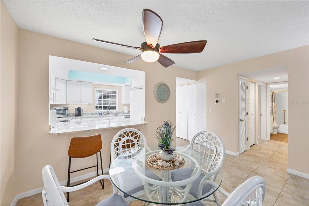 1531 Placida Road, Unit 4102 Englewood, FL 34223 - Photo 14 of 55 a dining room with furniture and window