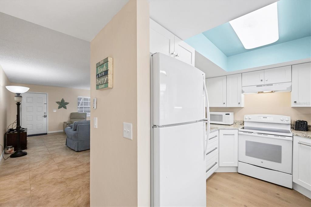 1531 Placida Road, Unit 4102 Englewood, FL 34223 - Photo 19 of 55 a white refrigerator freezer sitting in a kitchen