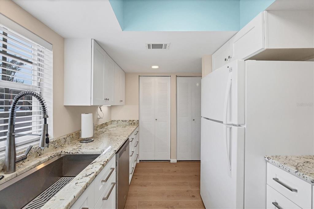 1531 Placida Road, Unit 4102 Englewood, FL 34223 - Photo 21 of 55 a kitchen with a refrigerator sink and stove
