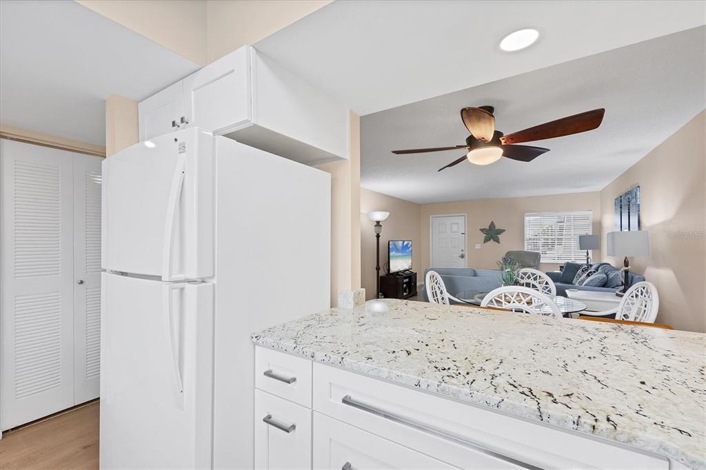 1531 Placida Road, Unit 4102 Englewood, FL 34223 - Photo 22 of 55 a view of a livingroom with furniture and a ceiling fan