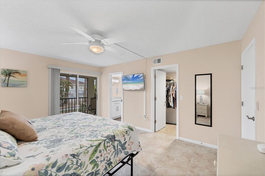 1531 Placida Road, Unit 4102 Englewood, FL 34223 - Photo 24 of 55 a bedroom with a large bed and a window